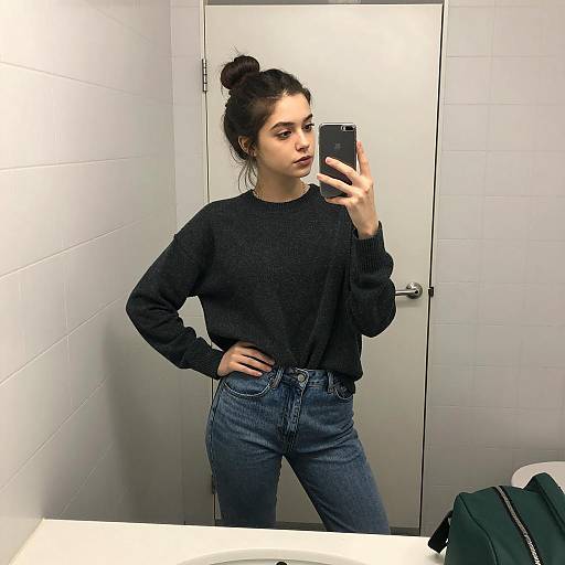 Young Woman Taking Mirror Selfie in Bathroom
