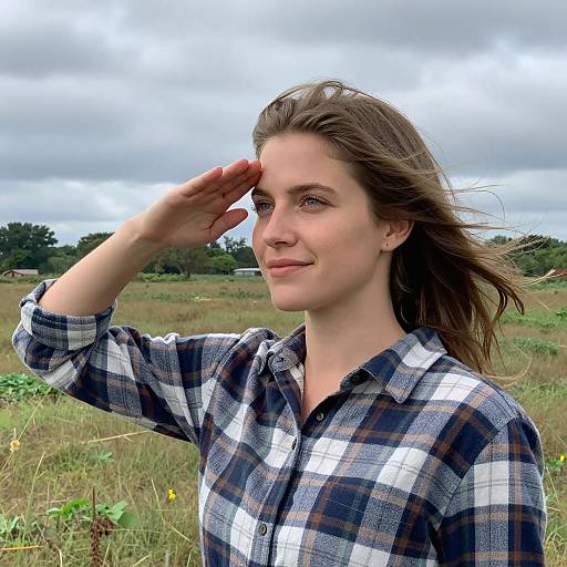 Saluting Woman in a Windy Field