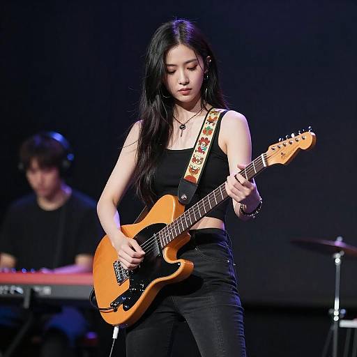 Young Woman Playing Electric Guitar