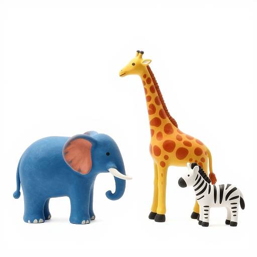 Photograph of a blue toy elephant, a yellow toy giraffe with red spots, and a white toy zebra with black stripes on a plain white