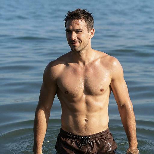 Muscular Man Smiling in Blue Water