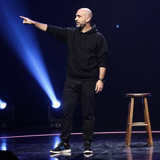 Bald Man on Stage with Blue Lights