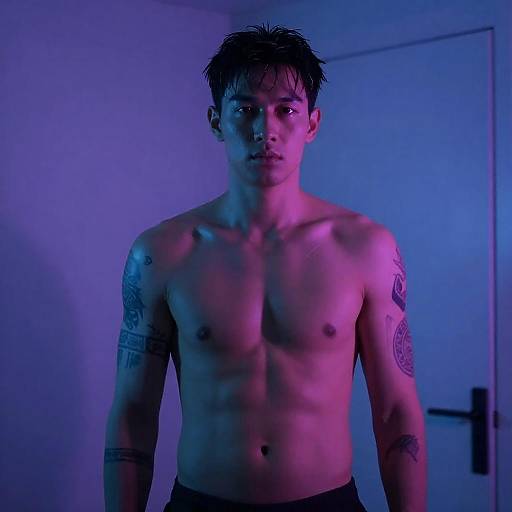 Neon-Lit Tattooed Man with Wet Hair