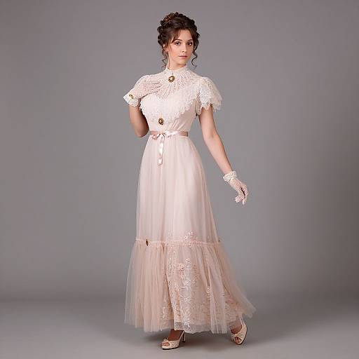 Photograph of a pale-skinned woman with dark hair in an updo, wearing a white lace Victorian-style dress and gloves, standing against a gray