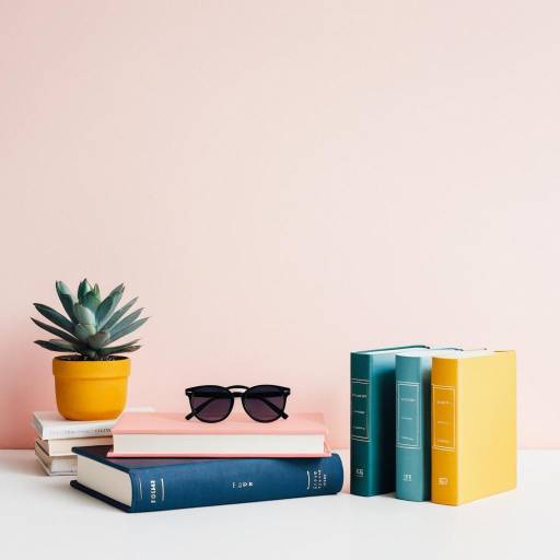 Stylish Books and Succulent with Sunglasses on Pink Background