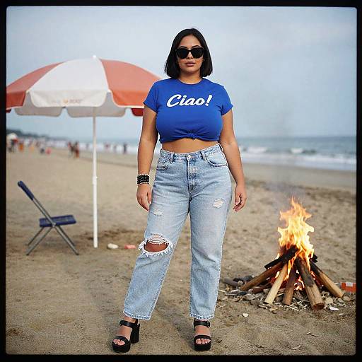 Photograph of a curvy woman with medium skin tone, black bob haircut, wearing a blue 