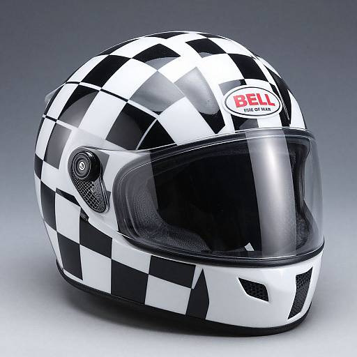 Photograph of a black-and-white checkered racing helmet with a clear visor and 