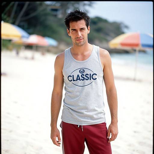 Photograph of a fit, dark-haired man in a white 