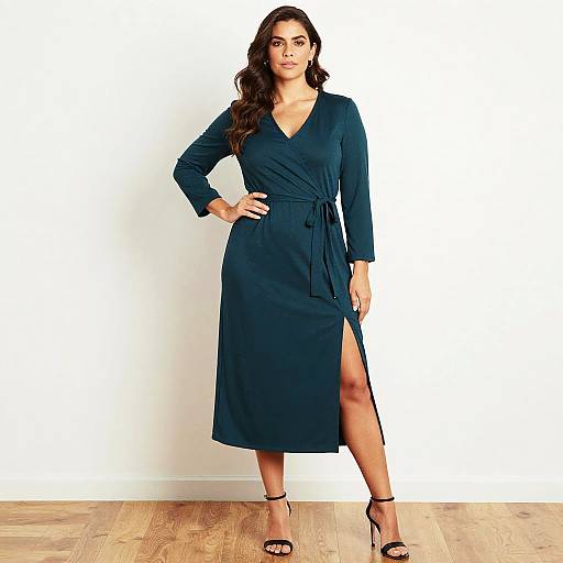 Photograph of a confident woman with long dark hair, wearing a black long-sleeve wrap dress with a thigh-high slit, black high heels,