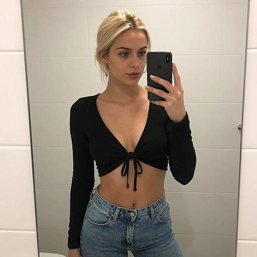 Blonde Woman Taking a Stylish Mirror Selfie