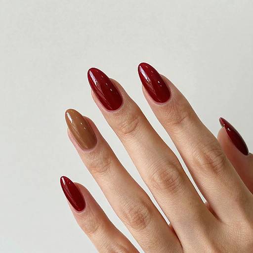 Glossy Almond Nails with Gold Accents