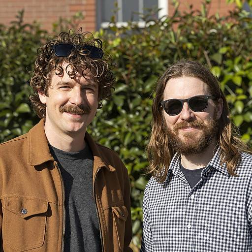 Two Smiling Men Outdoors in Sunlight