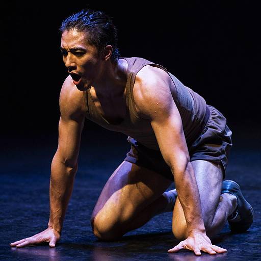 Expressive Dancer in Dramatic Spotlight