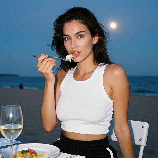 Woman at Moonlit Beach Dinner