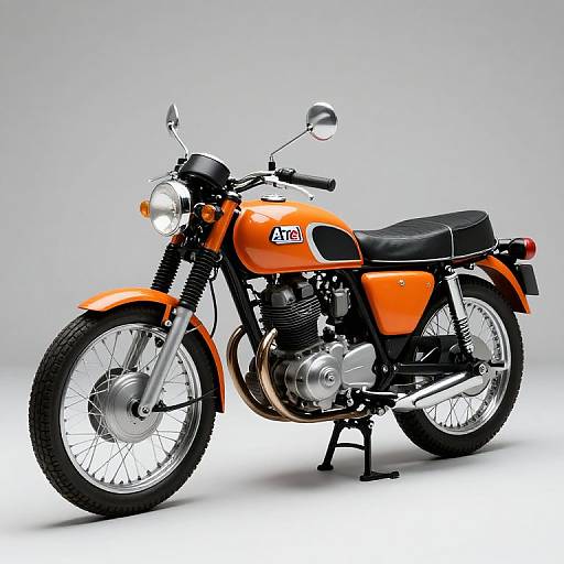 Photograph of a classic orange AJS motorcycle with black seat, chrome accents, round headlight, and white background, angled slightly to the left.