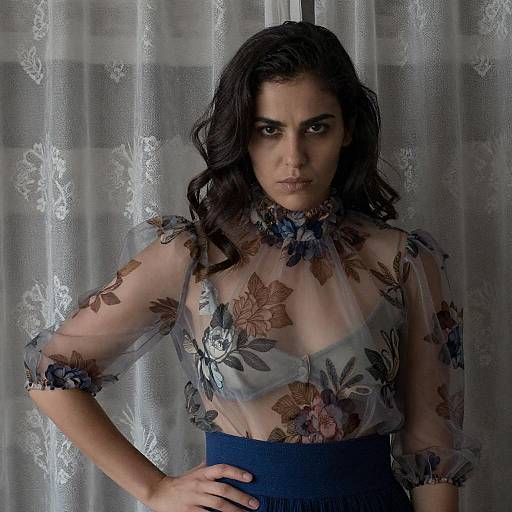 Woman in Sheer Floral Blouse with Intense Expression
