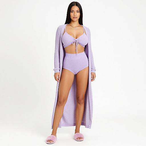 Photograph of a Latina woman with long black hair, wearing a white lace cardigan, tied crop top, high-waisted panties, and pink