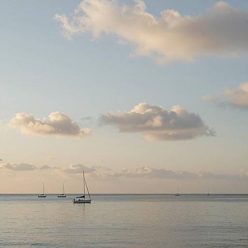 Tranquil Seascape with Sailboats and Clouds
