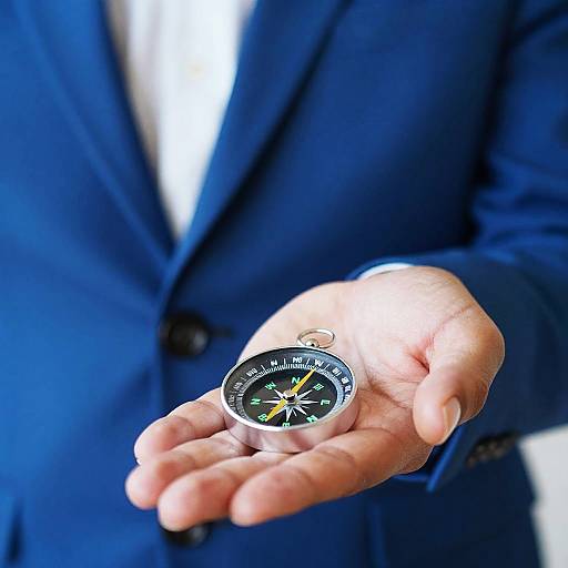 Man in Blue Suit Holding Compass