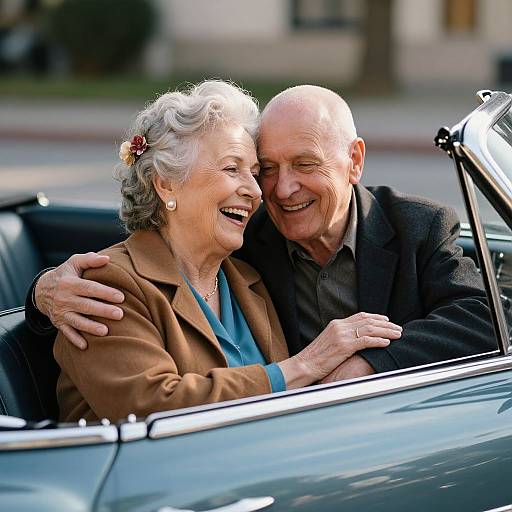Photograph of an elderly white couple smiling and leaning into each other in a black convertible, the woman in a brown jacket and blue blouse, the man