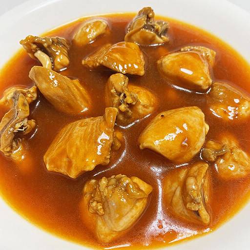 Glossy Orange Dish with Chunky Meat