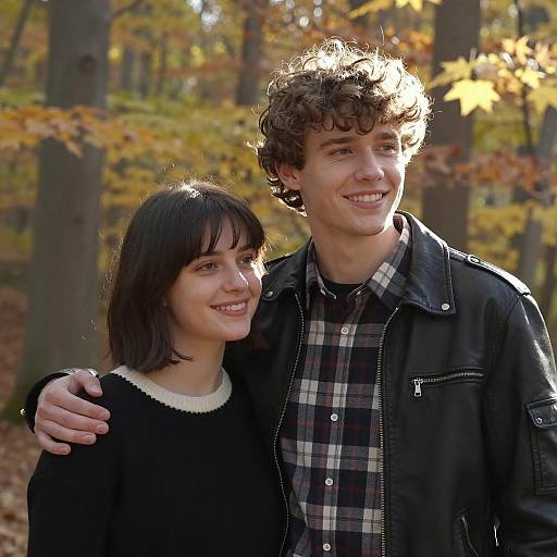 Young Couple Smiling in Autumn Forest