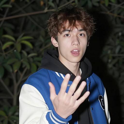 Surprised Young Man in Dim Light