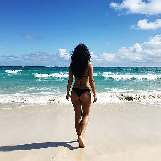 Barefoot Woman on Sunlit Beach