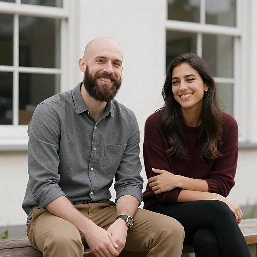 Smiling Couple Outdoors by White Building