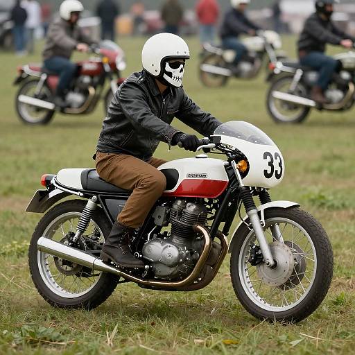 Vintage Motorcyclist in Grassy Field