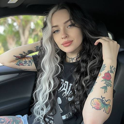 Young Woman with Tattoos in Car