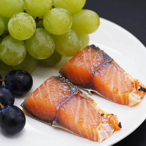 Vibrant Close-Up of Smoked Salmon and Grapes