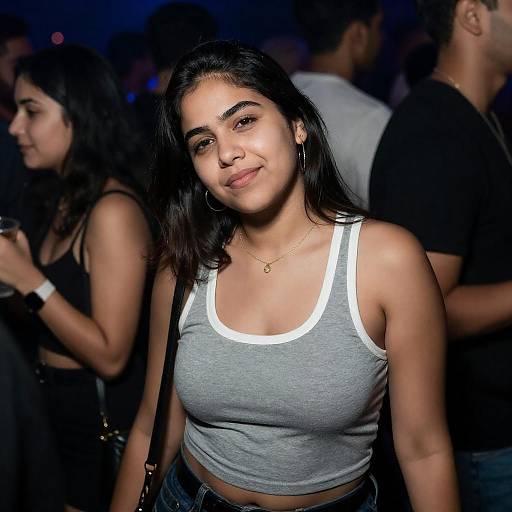 Relaxed Woman in Blue Nightclub Crowd