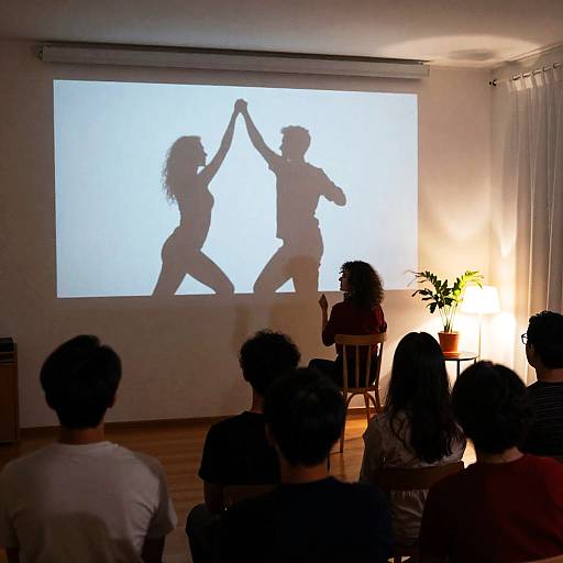 Dance Silhouettes in a Dimly Lit Room
