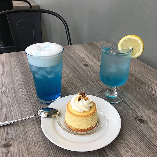 Blue Drinks and Yellow Cake on Table