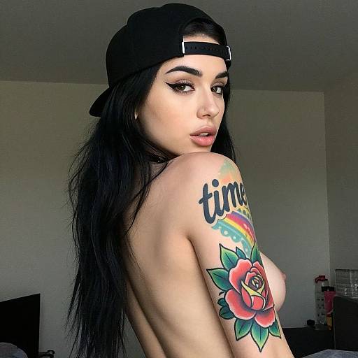 Photograph of a topless woman with long black hair, 