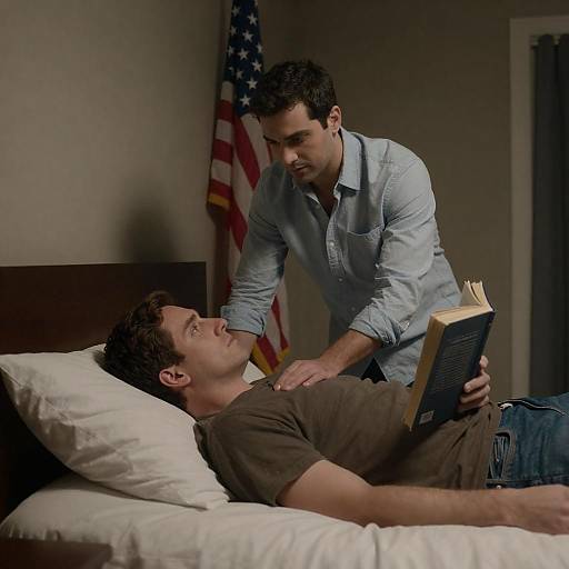 Two Men Reading in Dimly Lit Room with American Flag