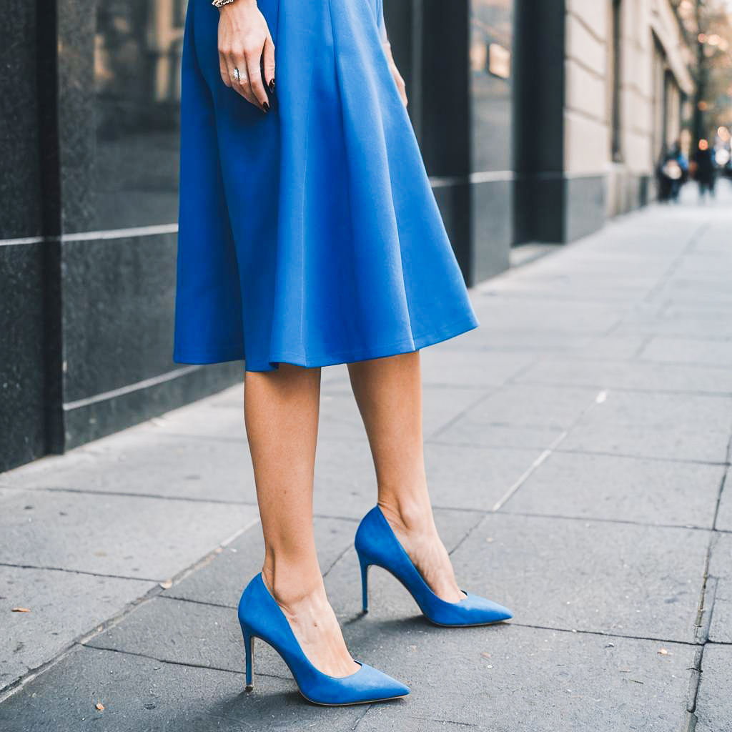 Elegant Woman in Striking Blue Heels