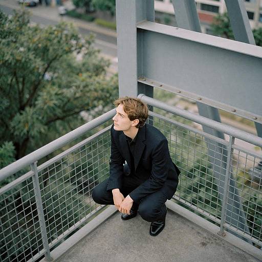 Urban Man on Metal Balcony