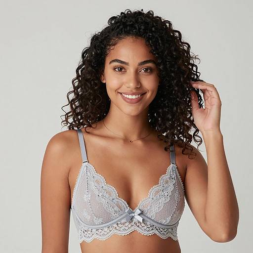 Smiling woman in light gray lace bra