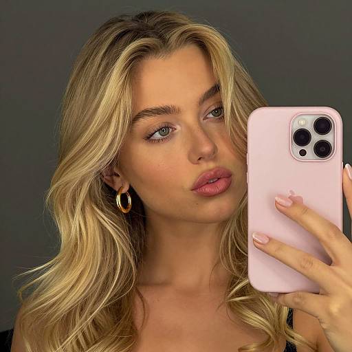 Blonde Woman Taking Mirror Selfie