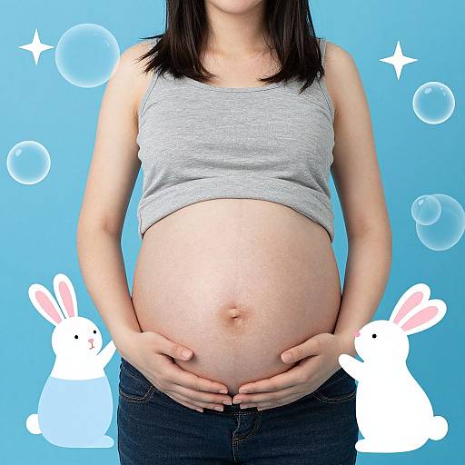 Photograph of a pregnant woman in a gray tank top and black jeans, hands on her belly, blue background with white and blue bunny illustrations.
