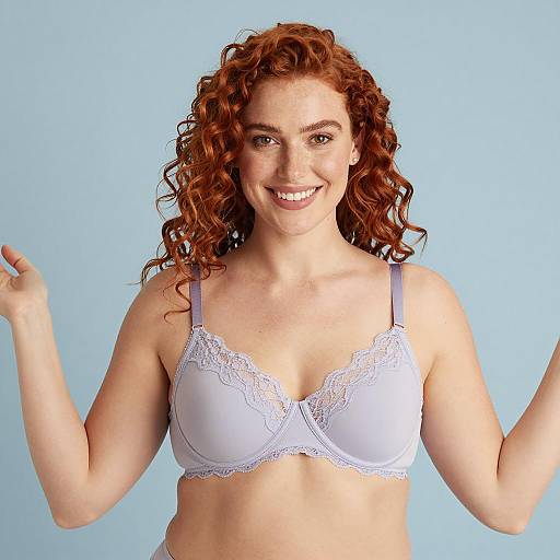 Smiling Redhead Woman in Light Purple Lace Bra