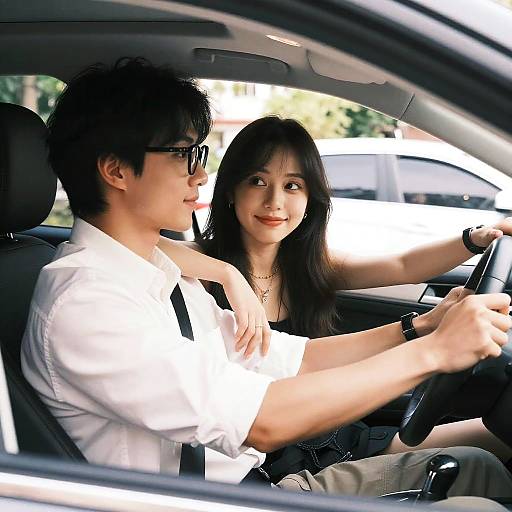 Young Couple Driving Together in Car