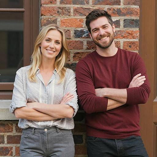 Joyful Couple Portrait Against Brick Wall