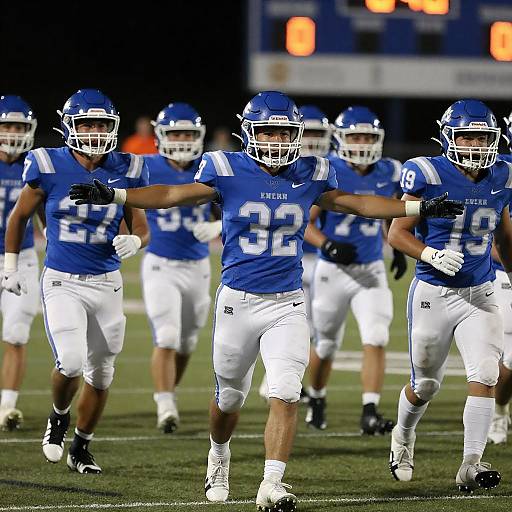 High School Football Team Running on Field