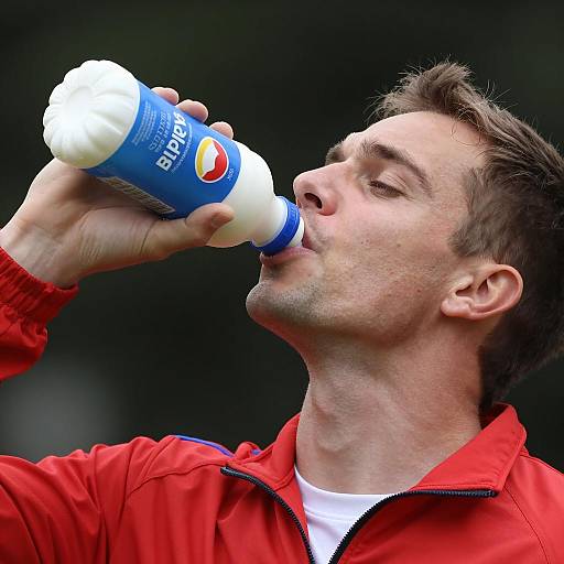 Man Drinking from a Milk Bottle