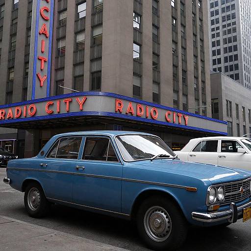Vintage Blue Sedan in Urban Landscape
