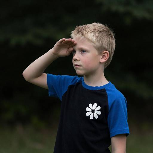 Blond Boy Saluting Outdoors