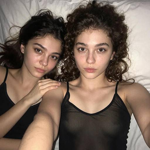 Two Young Women Lying on Bed Casual Natural Look